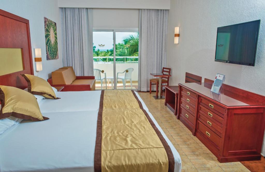 Postel nebo postele na pokoji v ubytování Riu Jalisco - All Inclusive