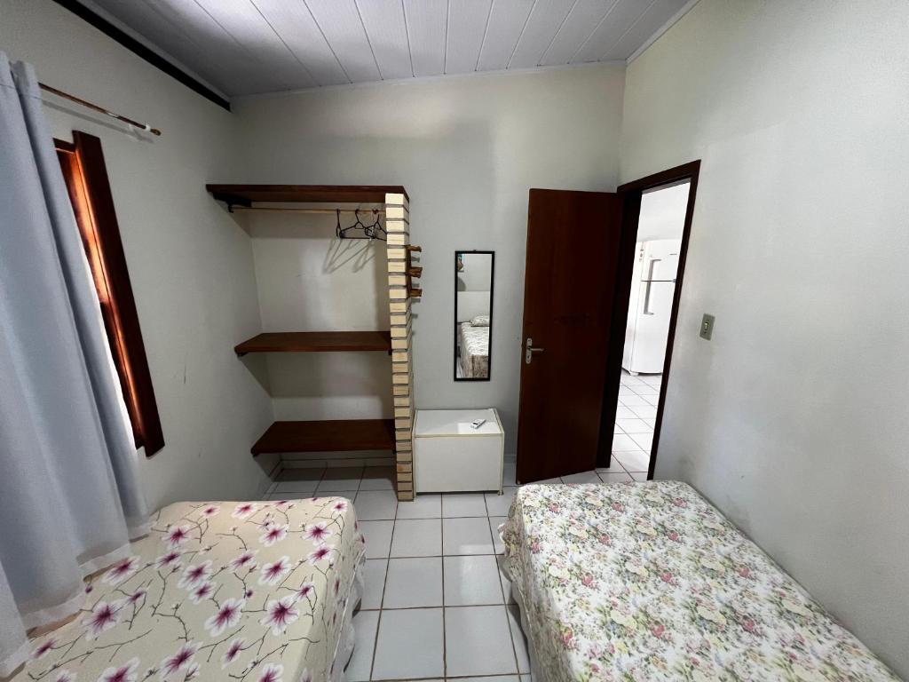 Postel nebo postele na pokoji v ubytování Chalés Coco Verde - Praia de Itacimirim