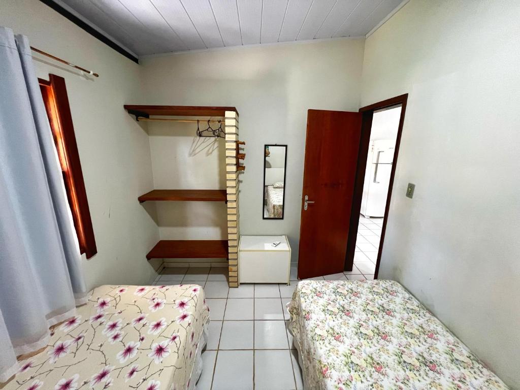 Postel nebo postele na pokoji v ubytování Chalés Coco Verde - Praia de Itacimirim