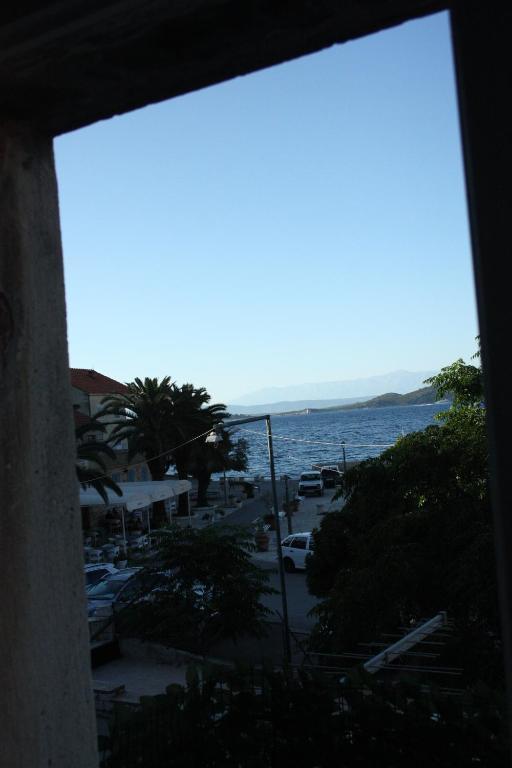 a view of the ocean from a building at Apartment Ivan in Račišće