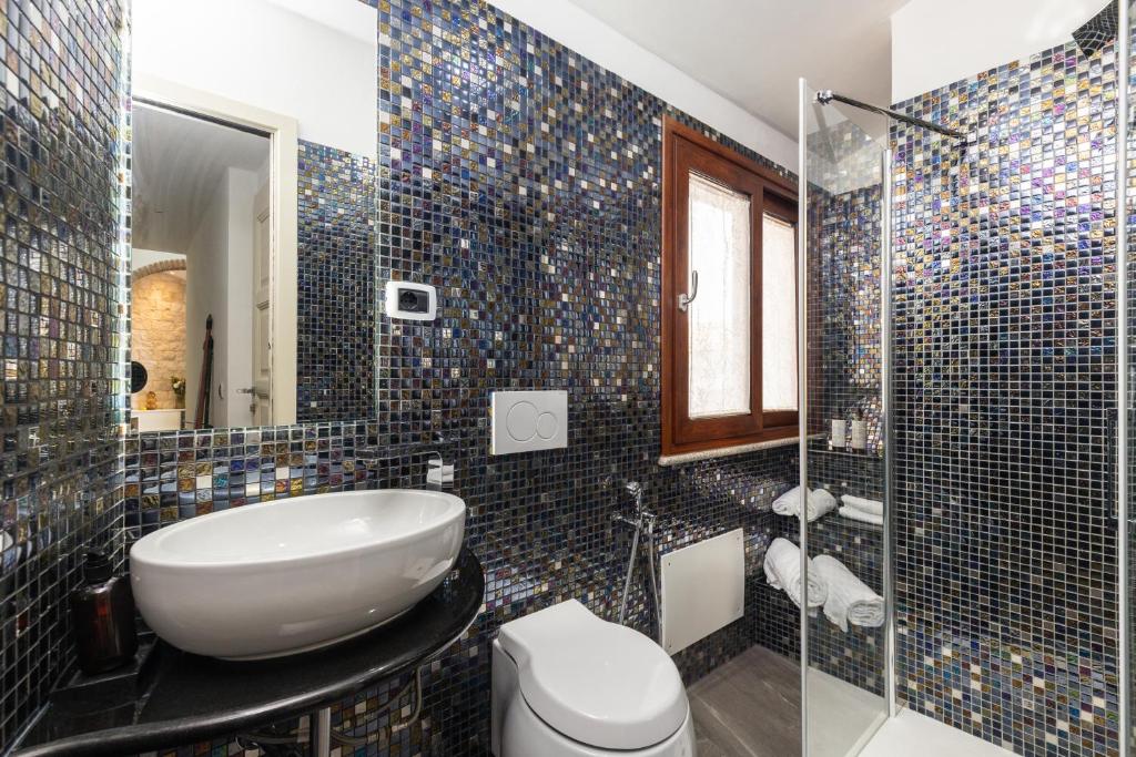 Koupelna v ubytování Loft Rooms I Cinque Mori