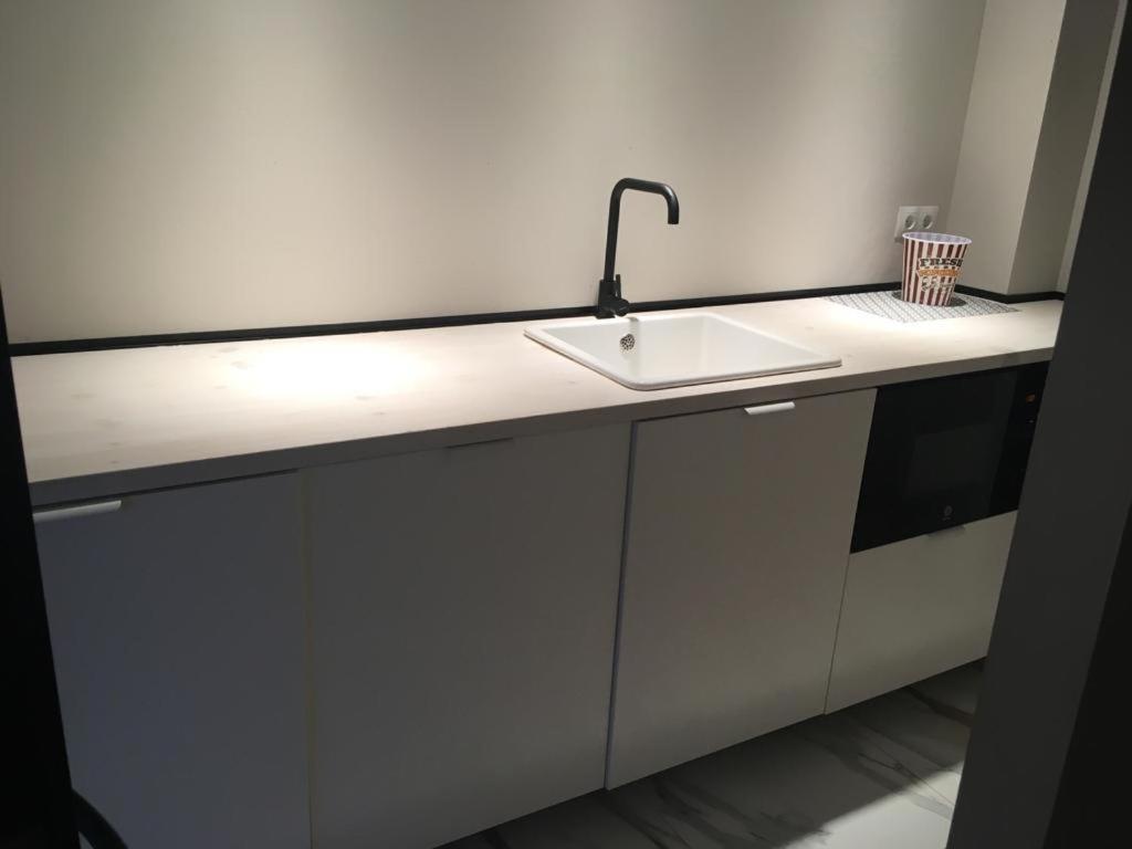 a white kitchen counter with a sink in it at Hacienda Soto-Hego Haizea in Chiclana de la Frontera