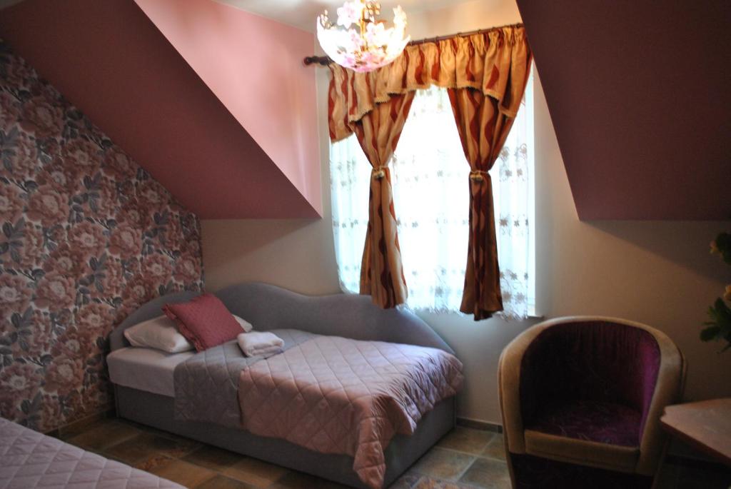 Postel nebo postele na pokoji v ubytování Flamingo