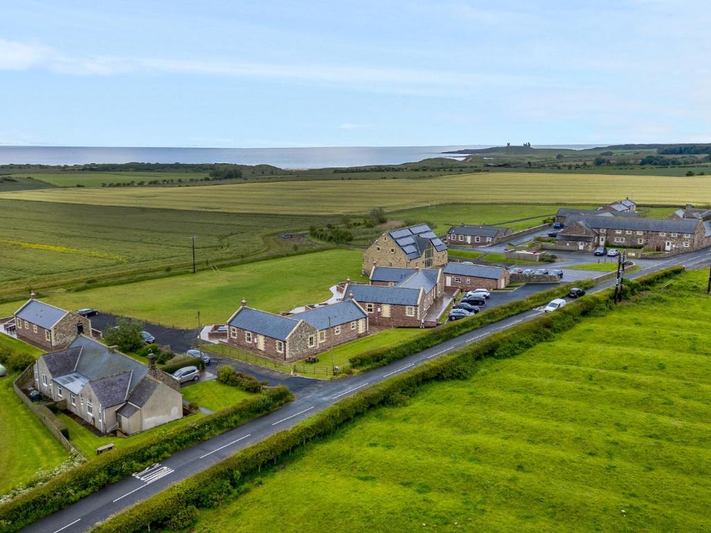 an aerial view of a house with a road at The Retreat in Alnwick