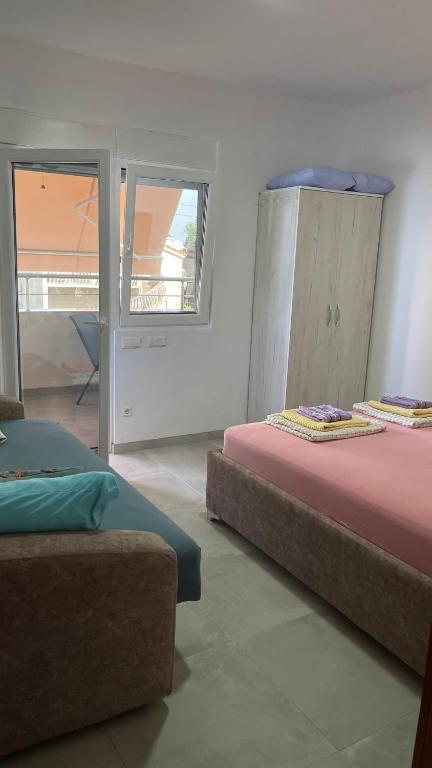 Postel nebo postele na pokoji v ubytování Ella Apartments