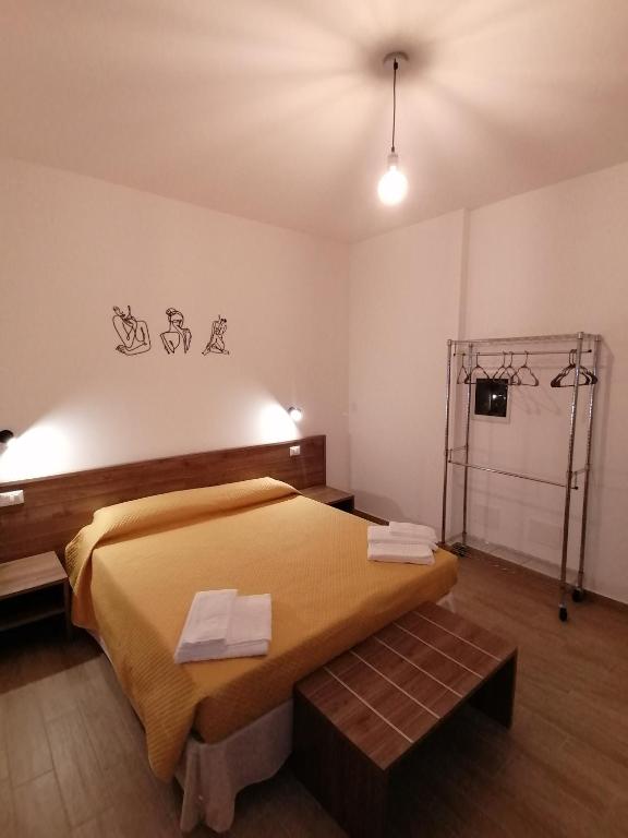 Postel nebo postele na pokoji v ubytování CLASS ROOMS AFFITTACAMERE