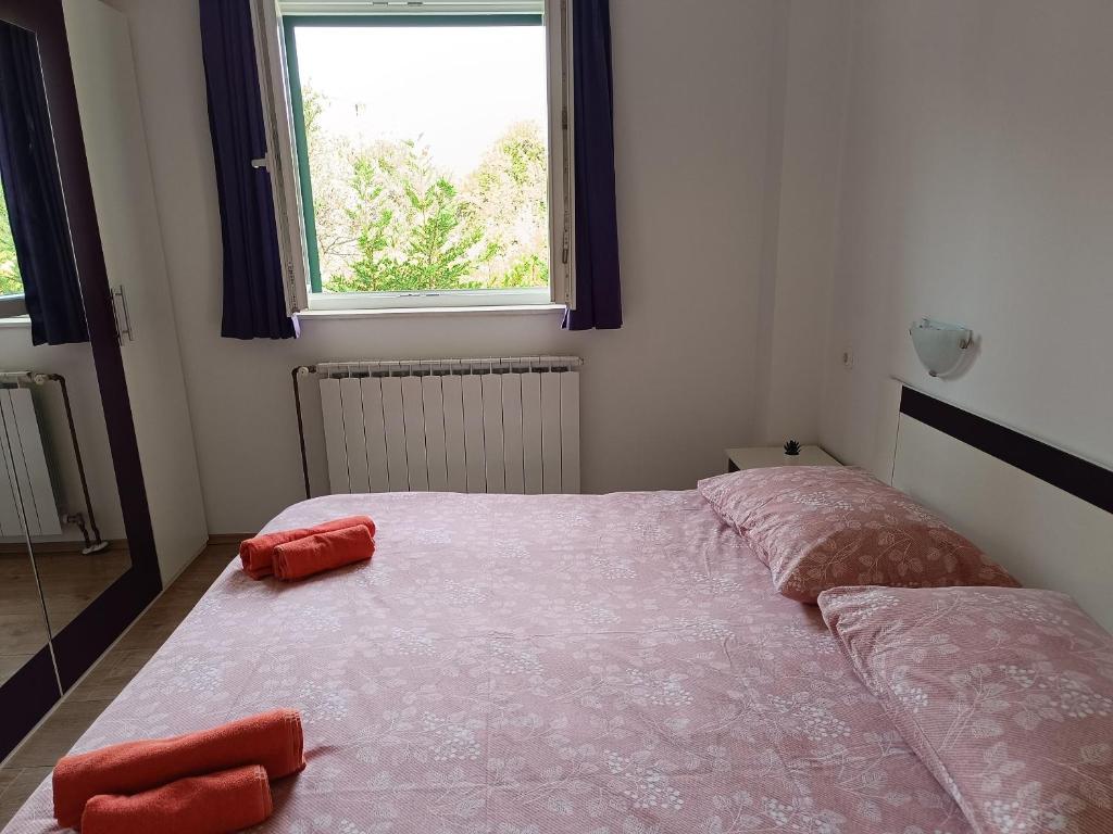 Posteľ alebo postele v izbe v ubytovaní Apartments Antonia