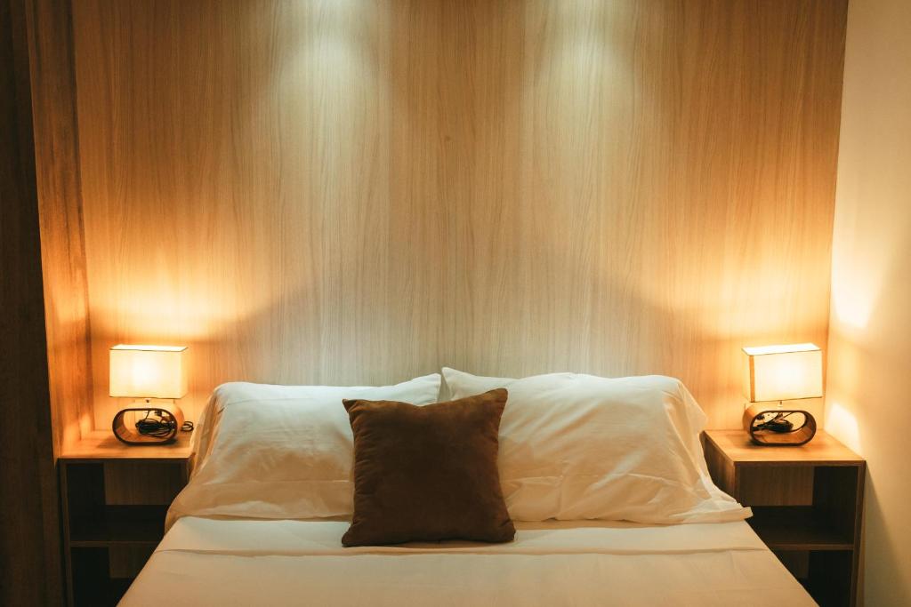 Postel nebo postele na pokoji v ubytování drb Suites