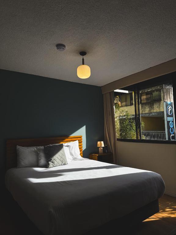 Postel nebo postele na pokoji v ubytování Hotel Agave Baños