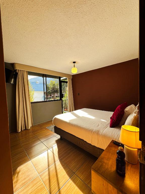 Postel nebo postele na pokoji v ubytování Hotel Agave Baños