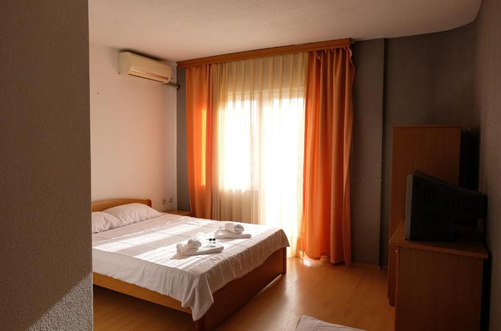 Postel nebo postele na pokoji v ubytování Hotel ARISTON