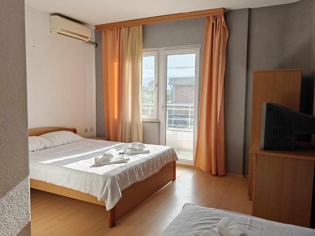 Postel nebo postele na pokoji v ubytování Hotel ARISTON
