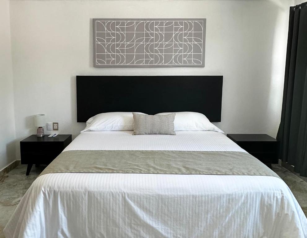 Postel nebo postele na pokoji v ubytování DUNAMIS HOTEL