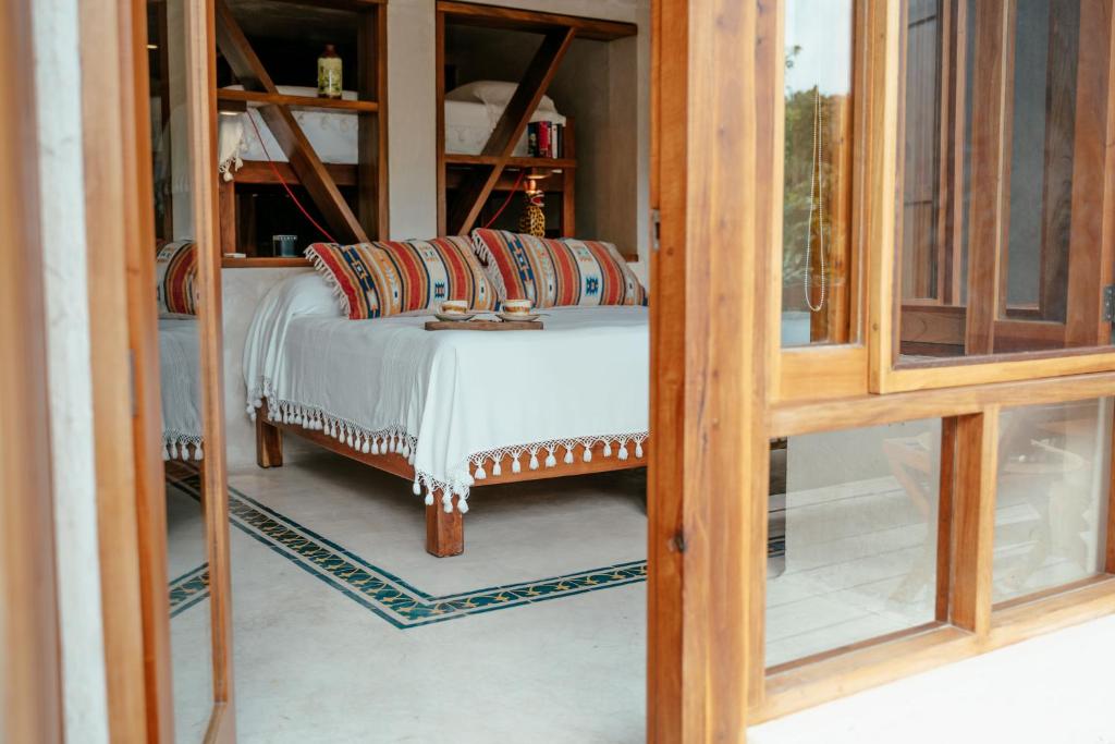 Postel nebo postele na pokoji v ubytování Hotel Poc Na Tulum