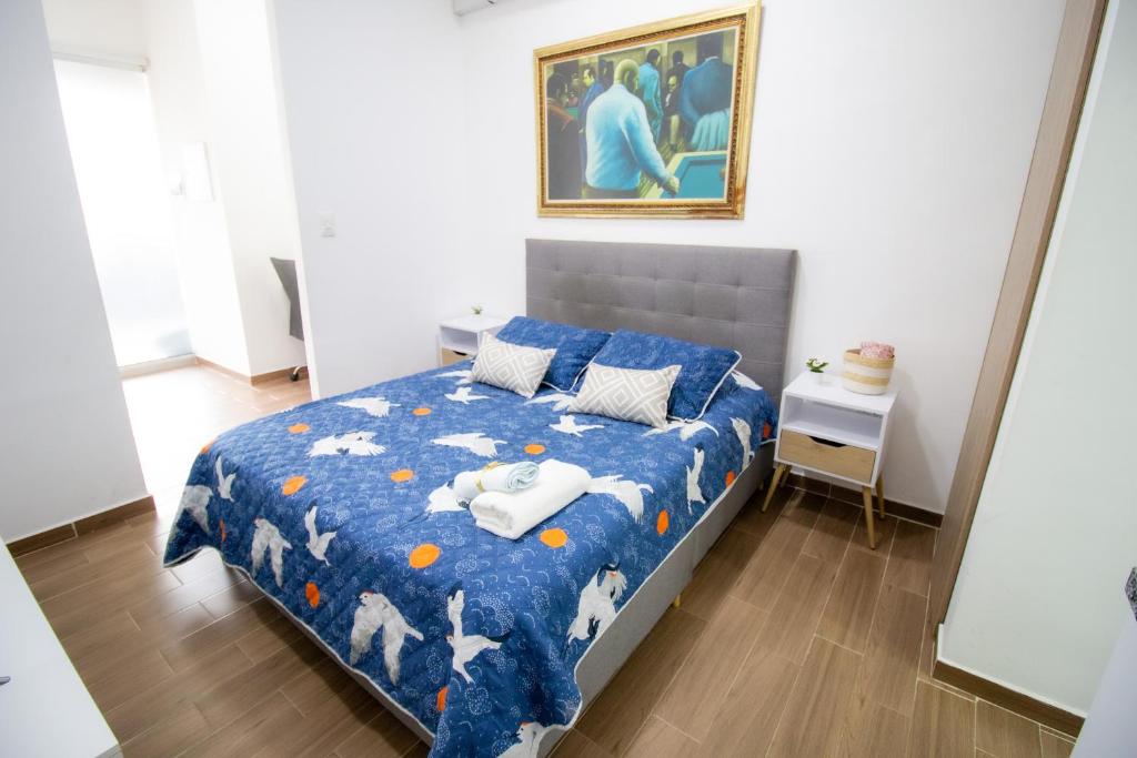 Ένα ή περισσότερα κρεβάτια σε δωμάτιο στο El Prado Suites Alojamiento