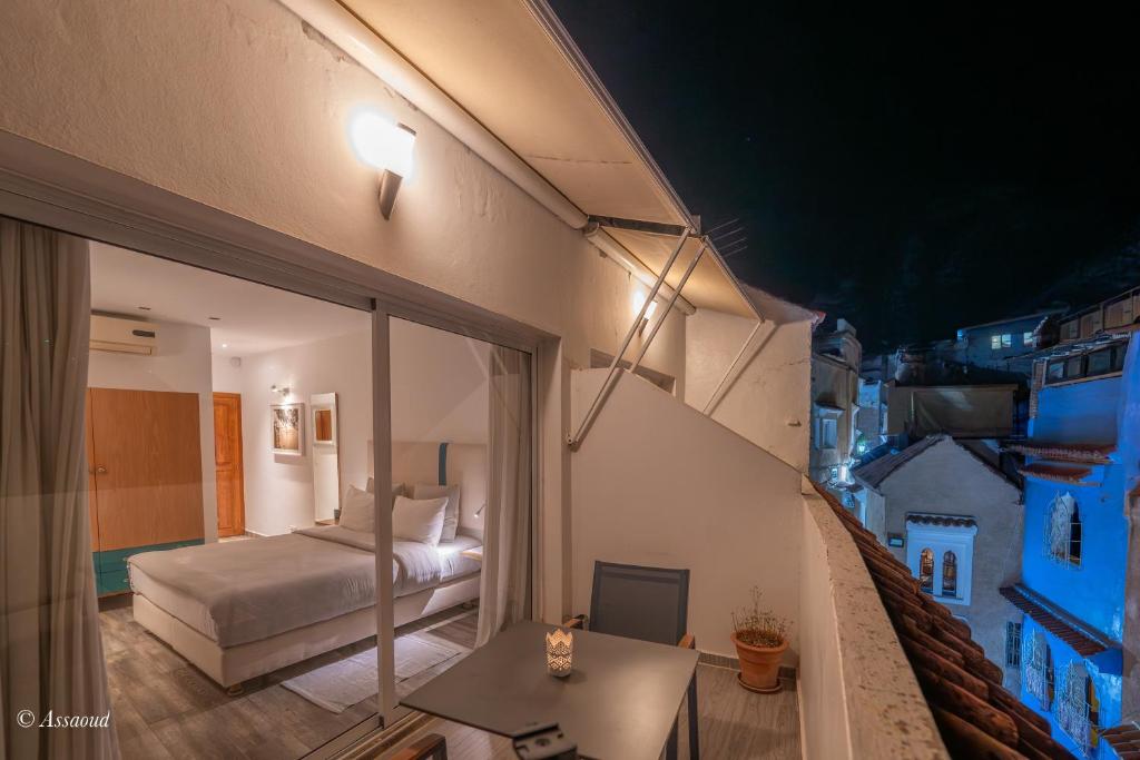 Postel nebo postele na pokoji v ubytování La Petite Chefchaouen