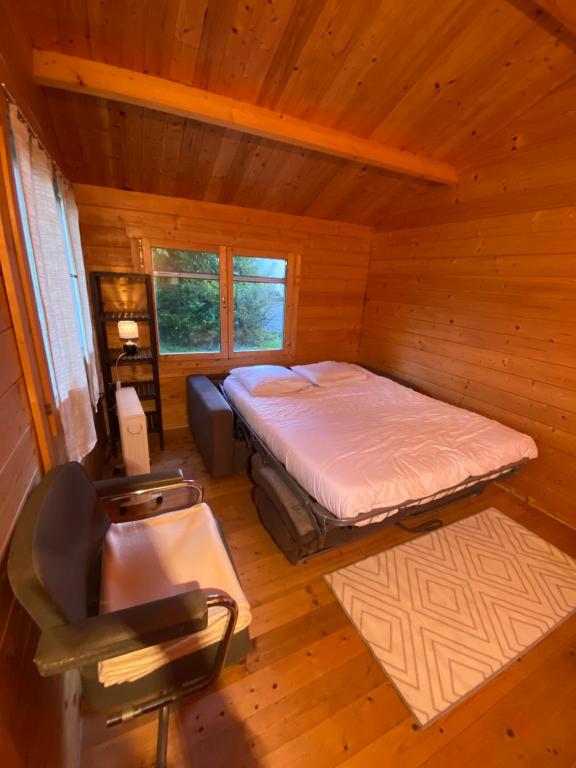 Ένα ή περισσότερα κρεβάτια σε δωμάτιο στο Maison calme à 20 minutes de Genève