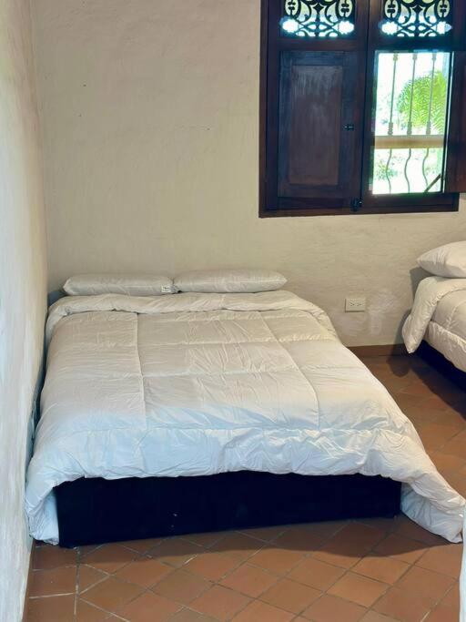 Postel nebo postele na pokoji v ubytování Villa privada Eje Cafetero