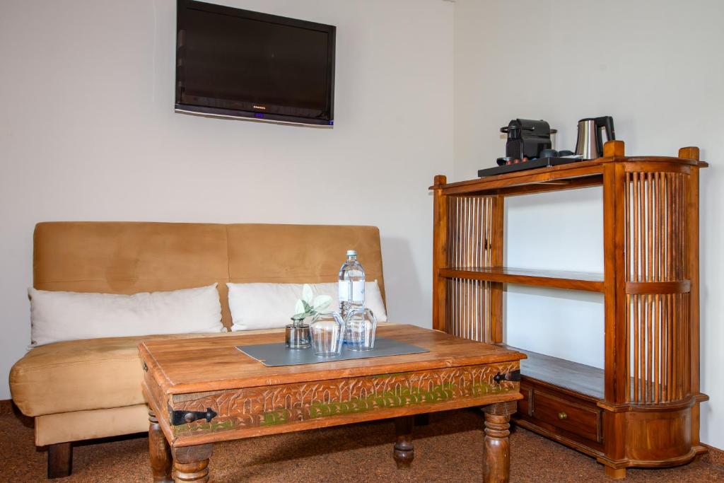 TV a/nebo společenská místnost v ubytování Hotel Stadtgut
