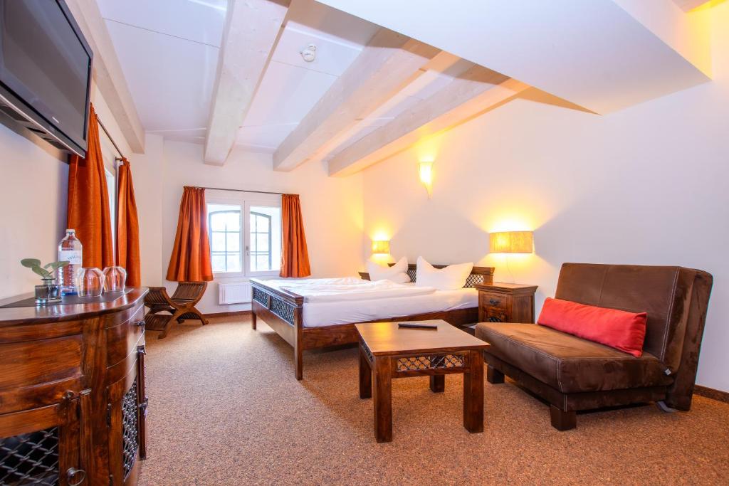 Postel nebo postele na pokoji v ubytování Hotel Stadtgut