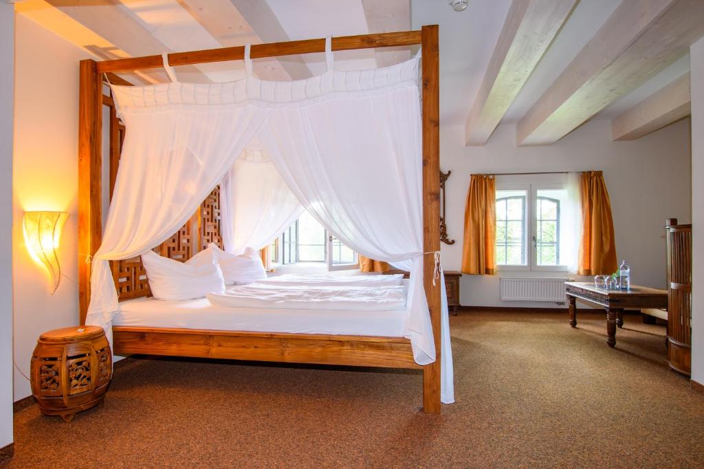 Postel nebo postele na pokoji v ubytování Hotel Stadtgut