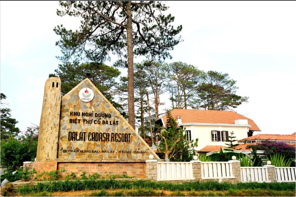 a large sign in front of a house at Dalat Cadasa Resort in Da Lat