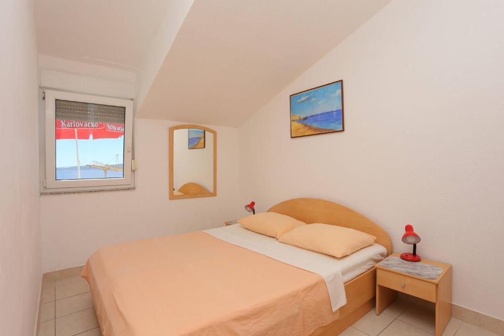 Posteľ alebo postele v izbe v ubytovaní Family friendly apartments with a swimming pool Businci, Ciovo - 11232