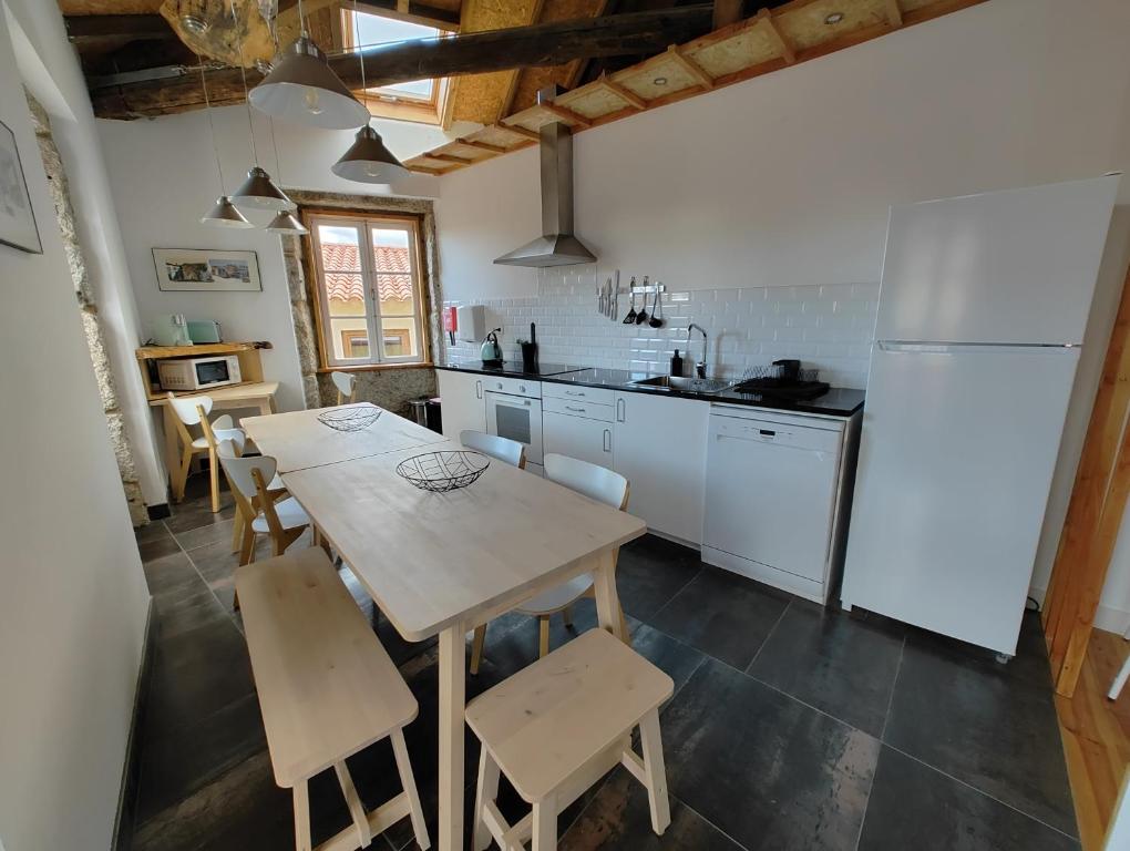 Kuchyň nebo kuchyňský kout v ubytování Urbe Sanchina - Hostel & Suites