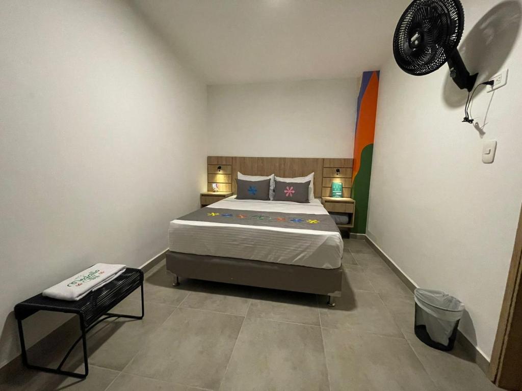 Postel nebo postele na pokoji v ubytování Hotel Medallo City