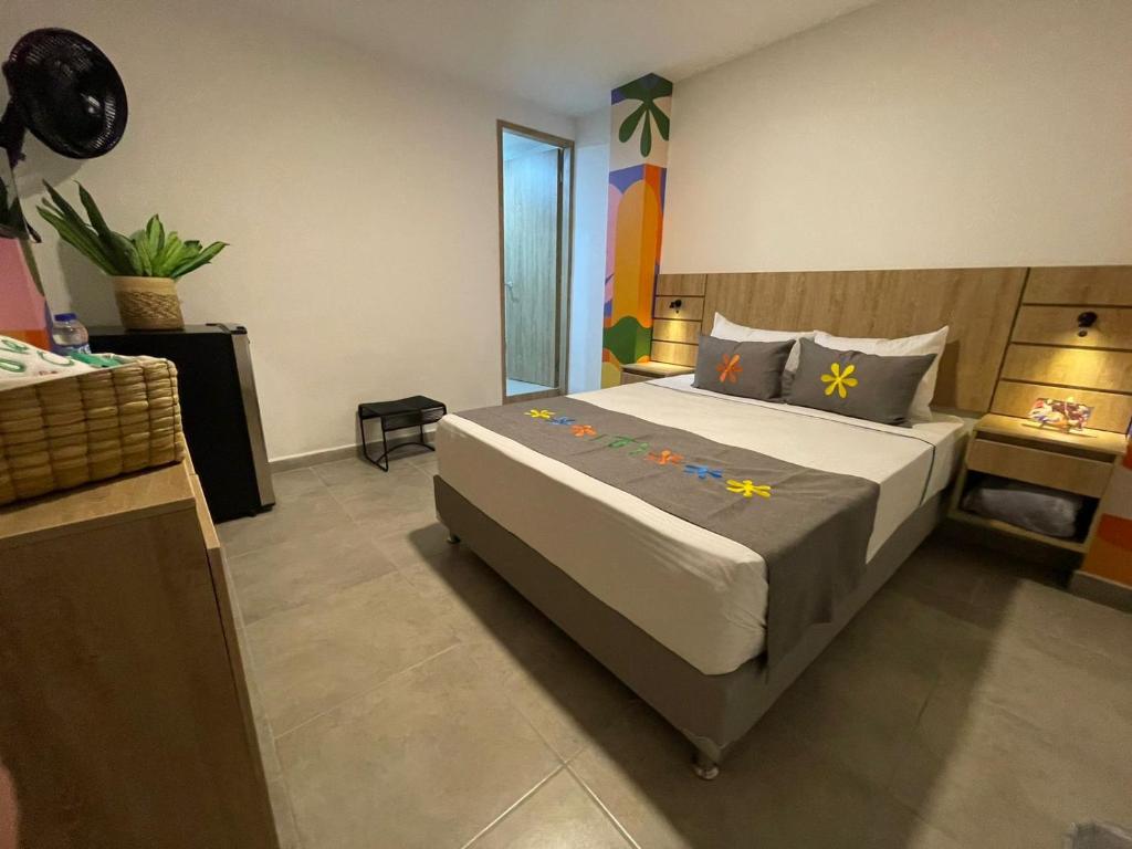 Postel nebo postele na pokoji v ubytování Hotel Medallo City