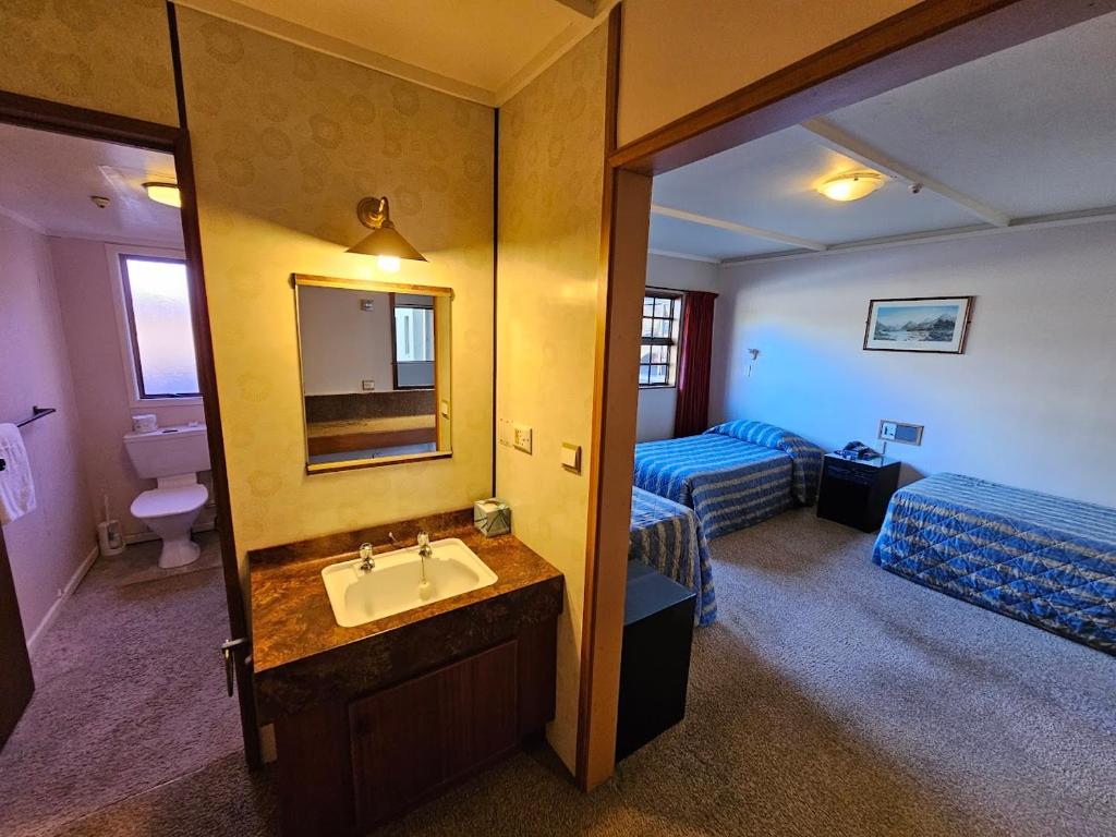 Postel nebo postele na pokoji v ubytování Discovery Countrytime Hotel