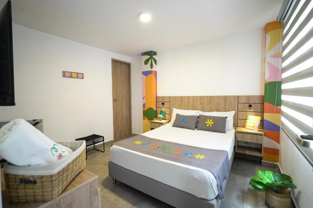 Postel nebo postele na pokoji v ubytování Hotel Medallo City