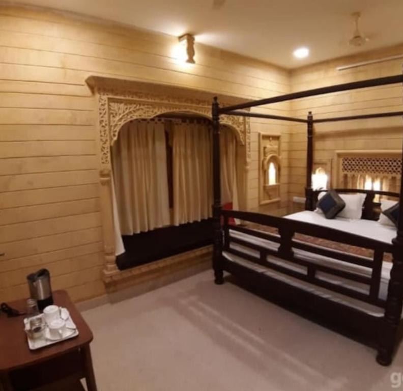 Postel nebo postele na pokoji v ubytování Hotel Janat Heritage