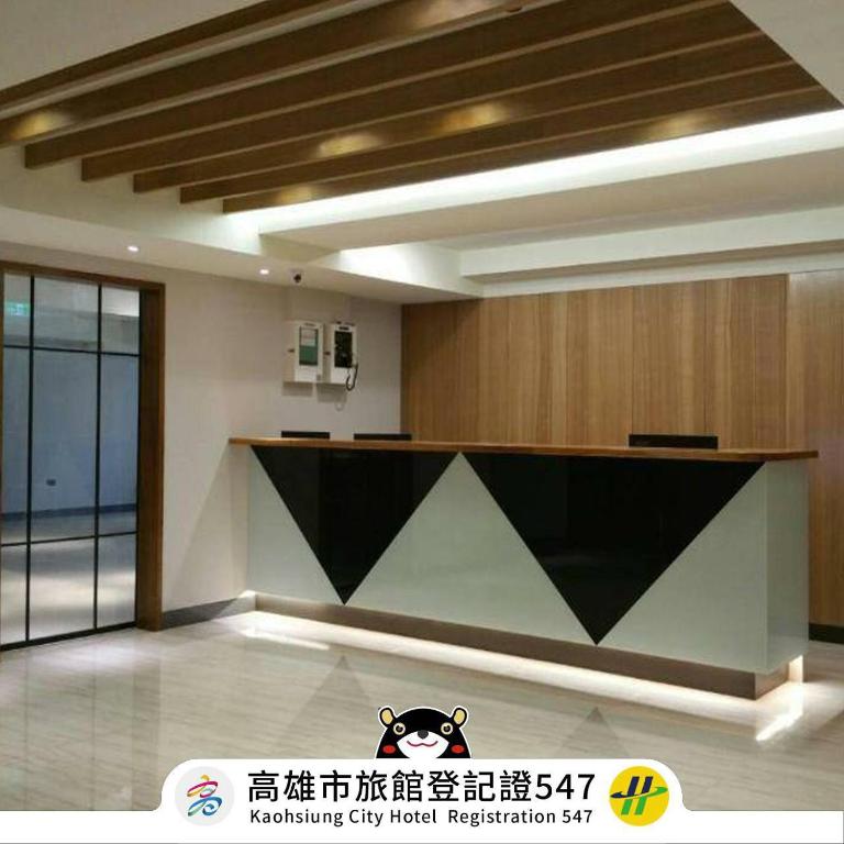 a room with a reception desk in a building at 萬酈精品旅館 in Kaohsiung