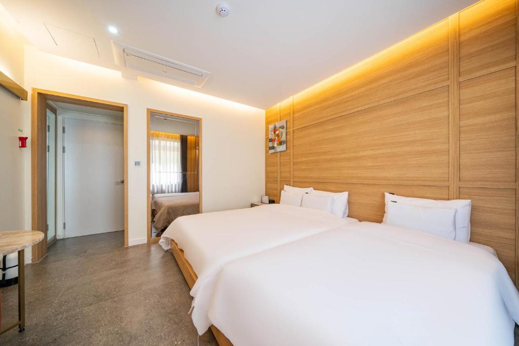 Postel nebo postele na pokoji v ubytování Suncheon Hound Hotel Suncheon Station Branch