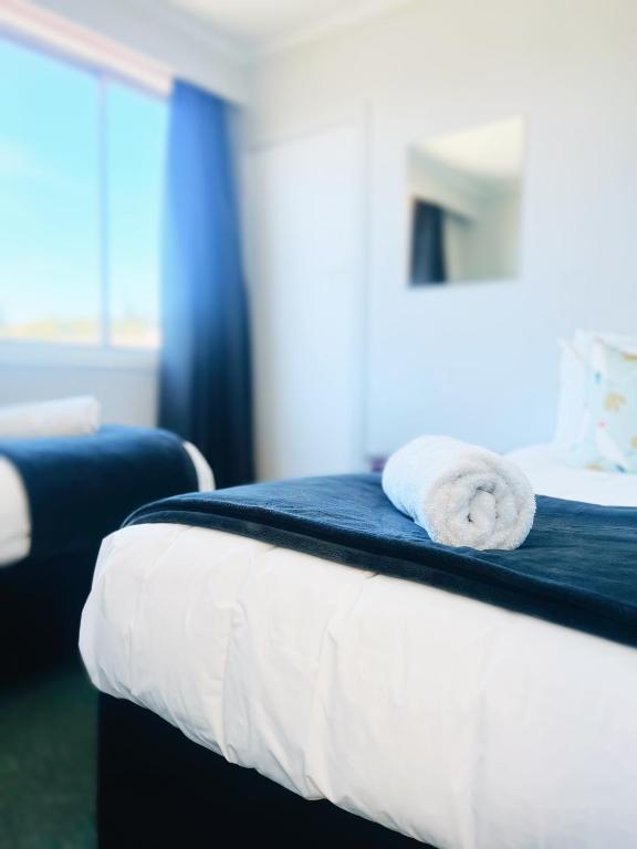 Postel nebo postele na pokoji v ubytování Kurow Motel
