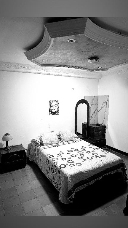 Postel nebo postele na pokoji v ubytování La Casona Hostal