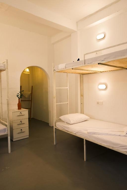 Postel nebo postele na pokoji v ubytování Fins Arugambay