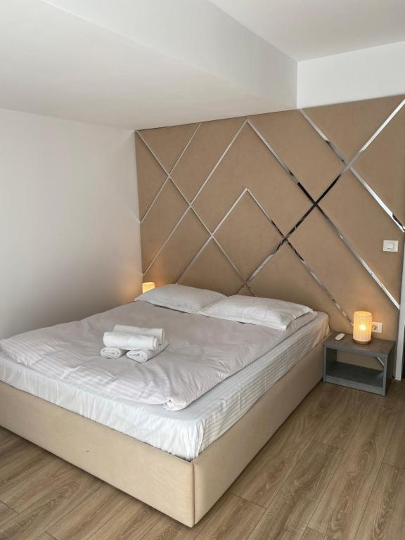 Кровать или кровати в номере Camera Deluxe Pensiunea Liziera