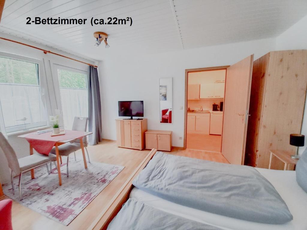 Postel nebo postele na pokoji v ubytování Dünenhaus Fewos - Zum Strand 50m