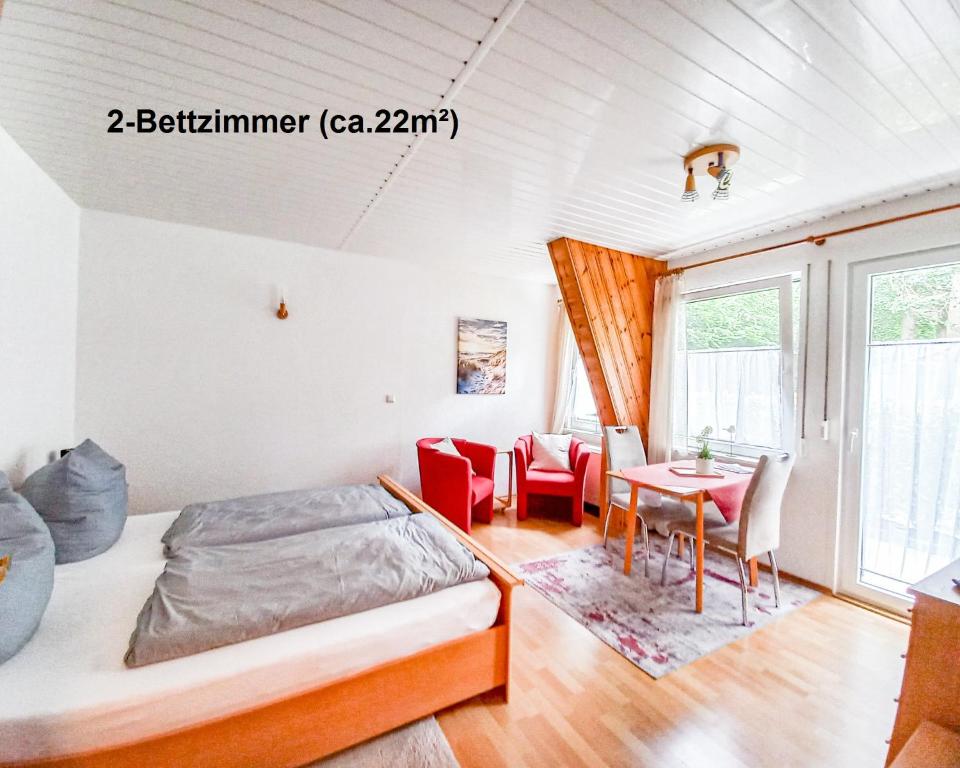 Postel nebo postele na pokoji v ubytování Dünenhaus Fewos - Zum Strand 50m