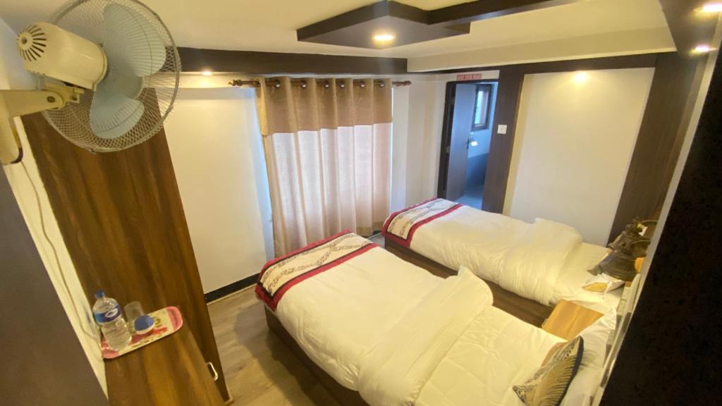 Postel nebo postele na pokoji v ubytování Shiva Guest House