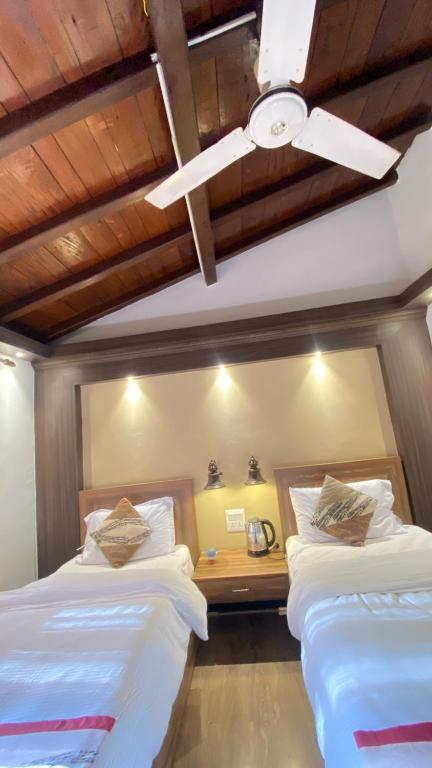 Postel nebo postele na pokoji v ubytování Shiva Guest House
