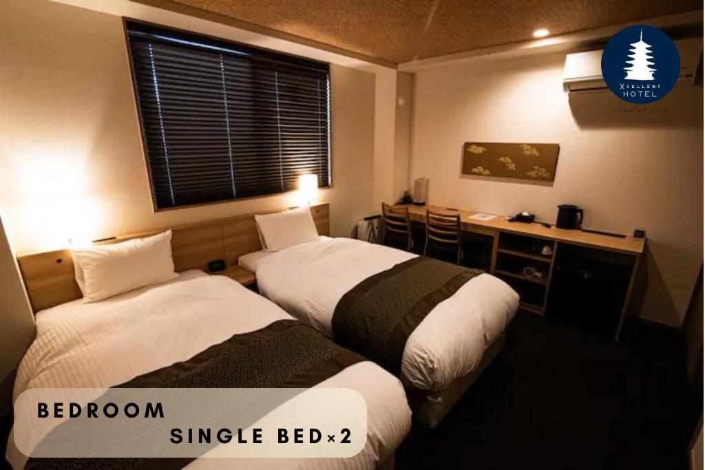 Postel nebo postele na pokoji v ubytování Xcellent Hotel