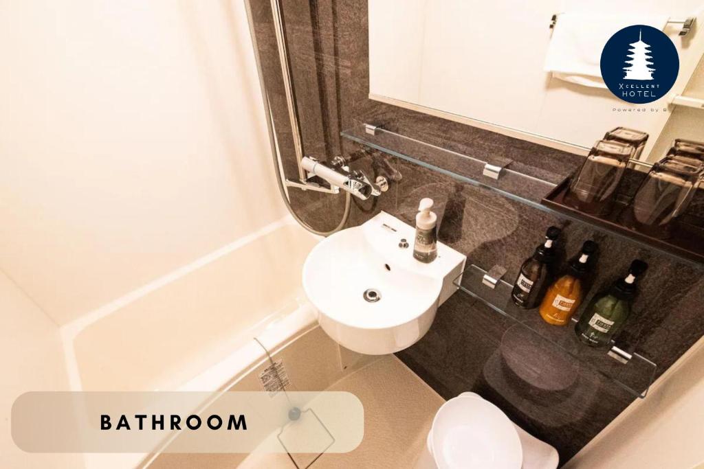 Koupelna v ubytování Xcellent Hotel