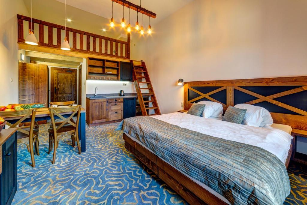 Postel nebo postele na pokoji v ubytování Hotel Strachan Family Jasná