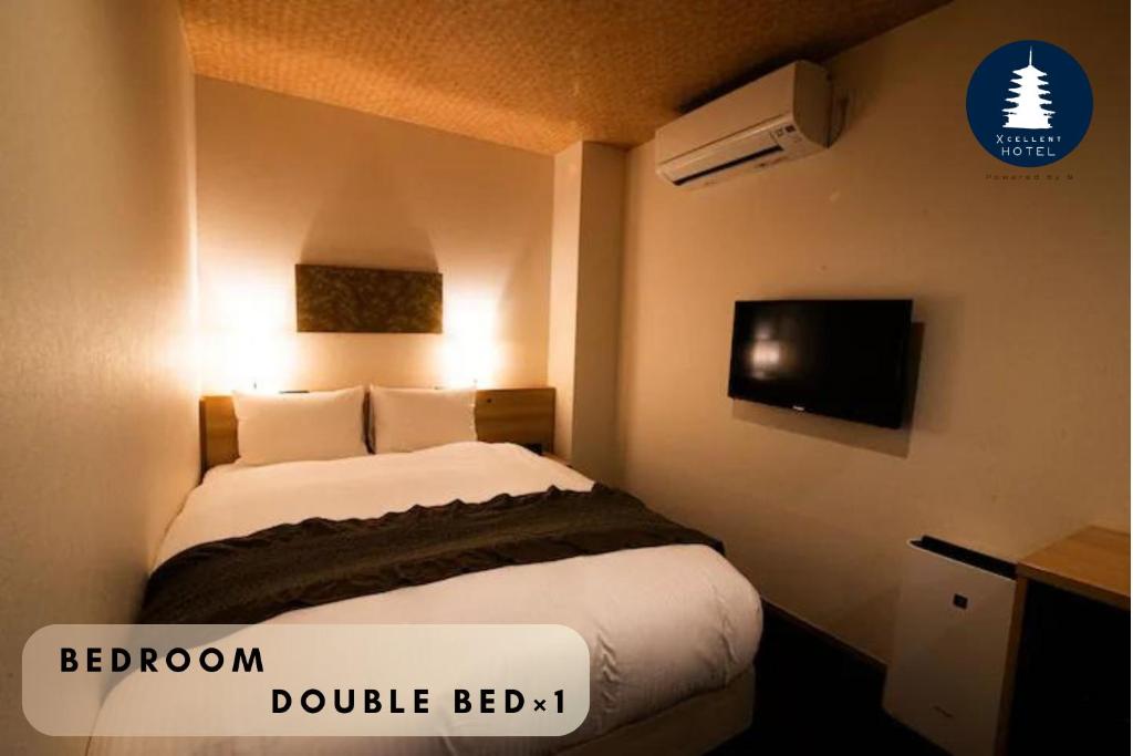 Postel nebo postele na pokoji v ubytování Xcellent Hotel