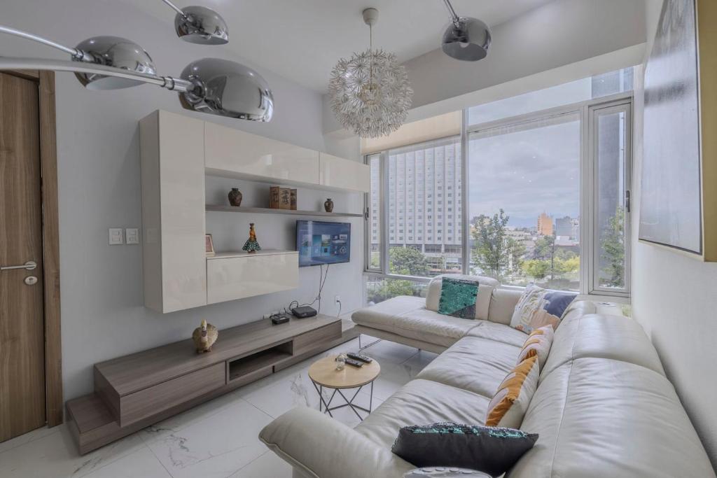 Zona de estar de Apt with Reforma View Pool and Jacuzzi