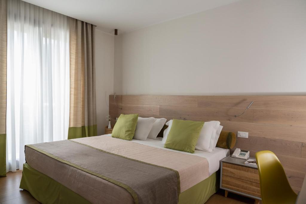 Postel nebo postele na pokoji v ubytování Hotel Petrarca Terme