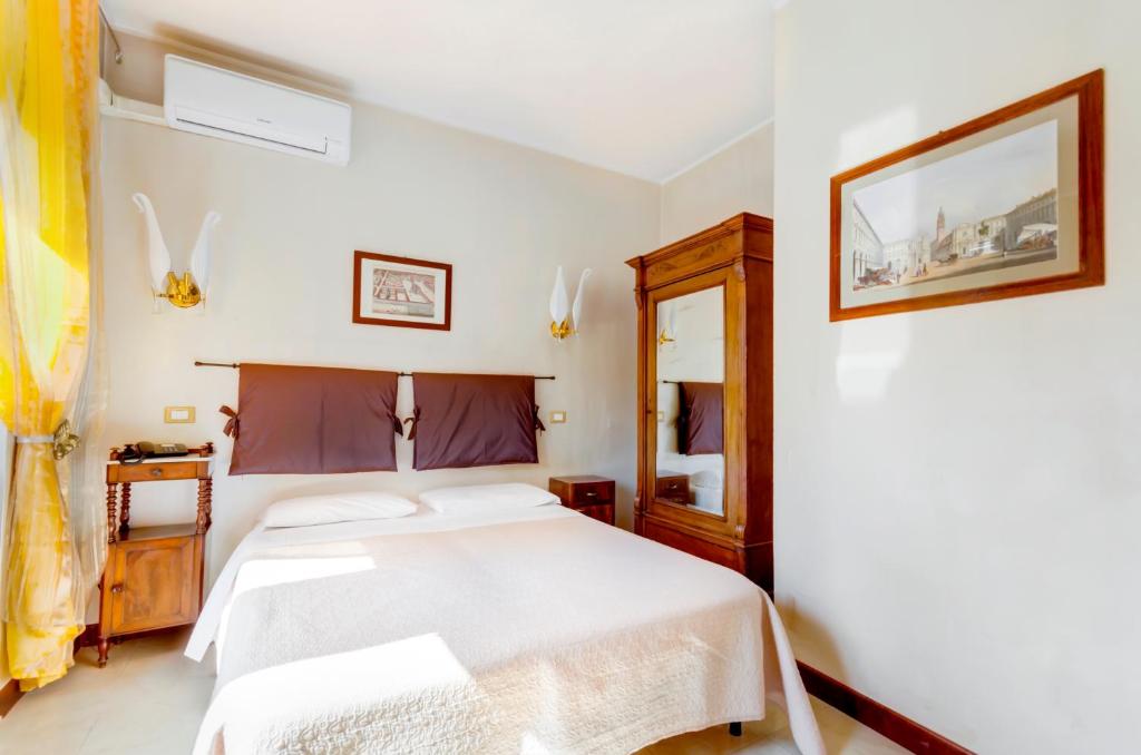 Posteľ alebo postele v izbe v ubytovaní Hotel Original